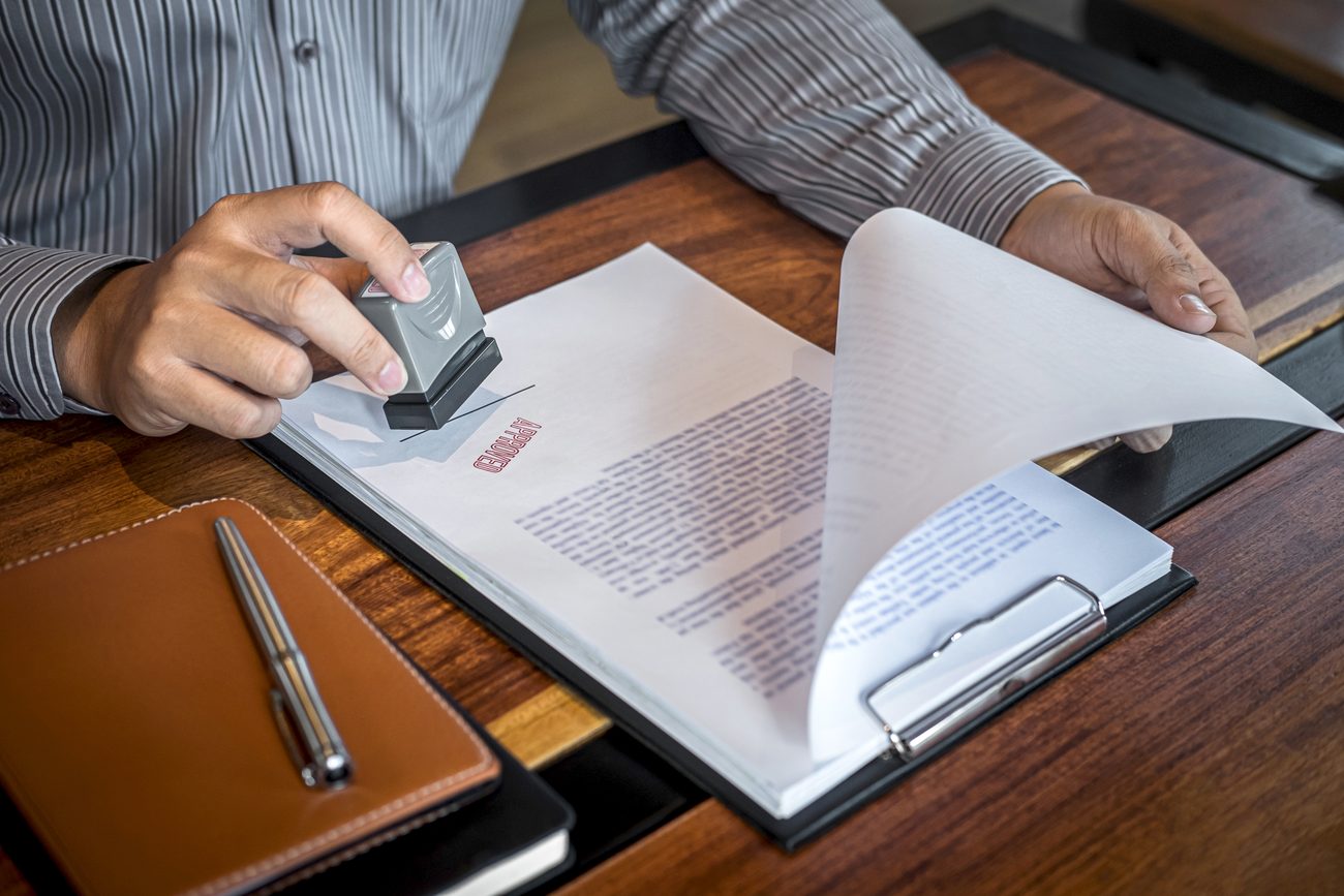 Notary public stamping a document