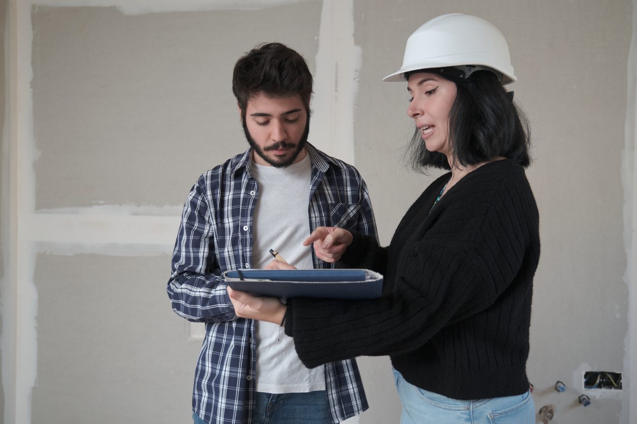 disappointed woman apartment owner with document, repair works in house