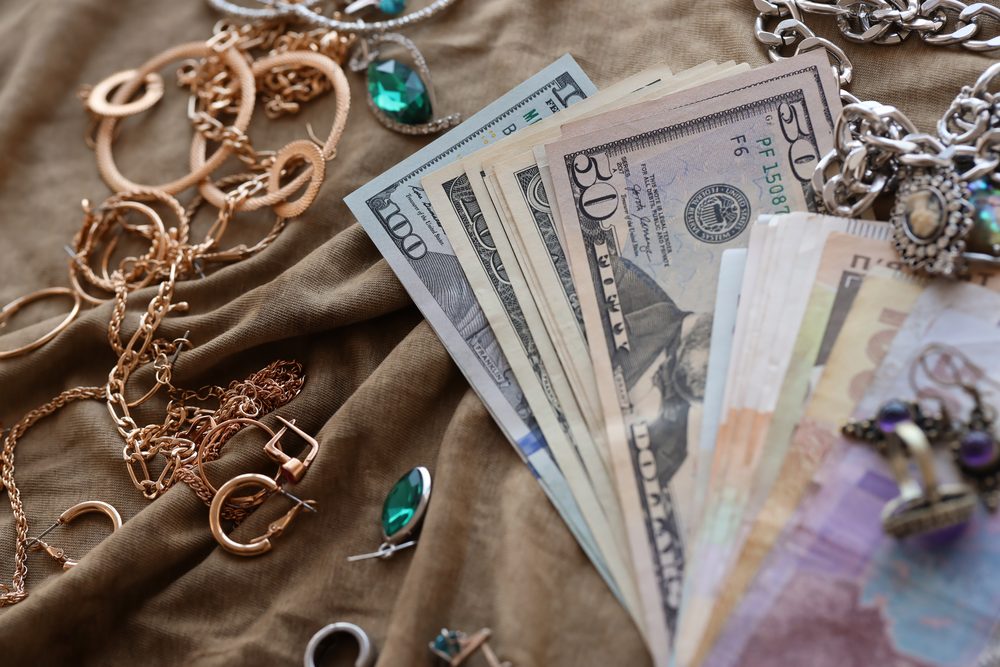 Money and jewelry on a table