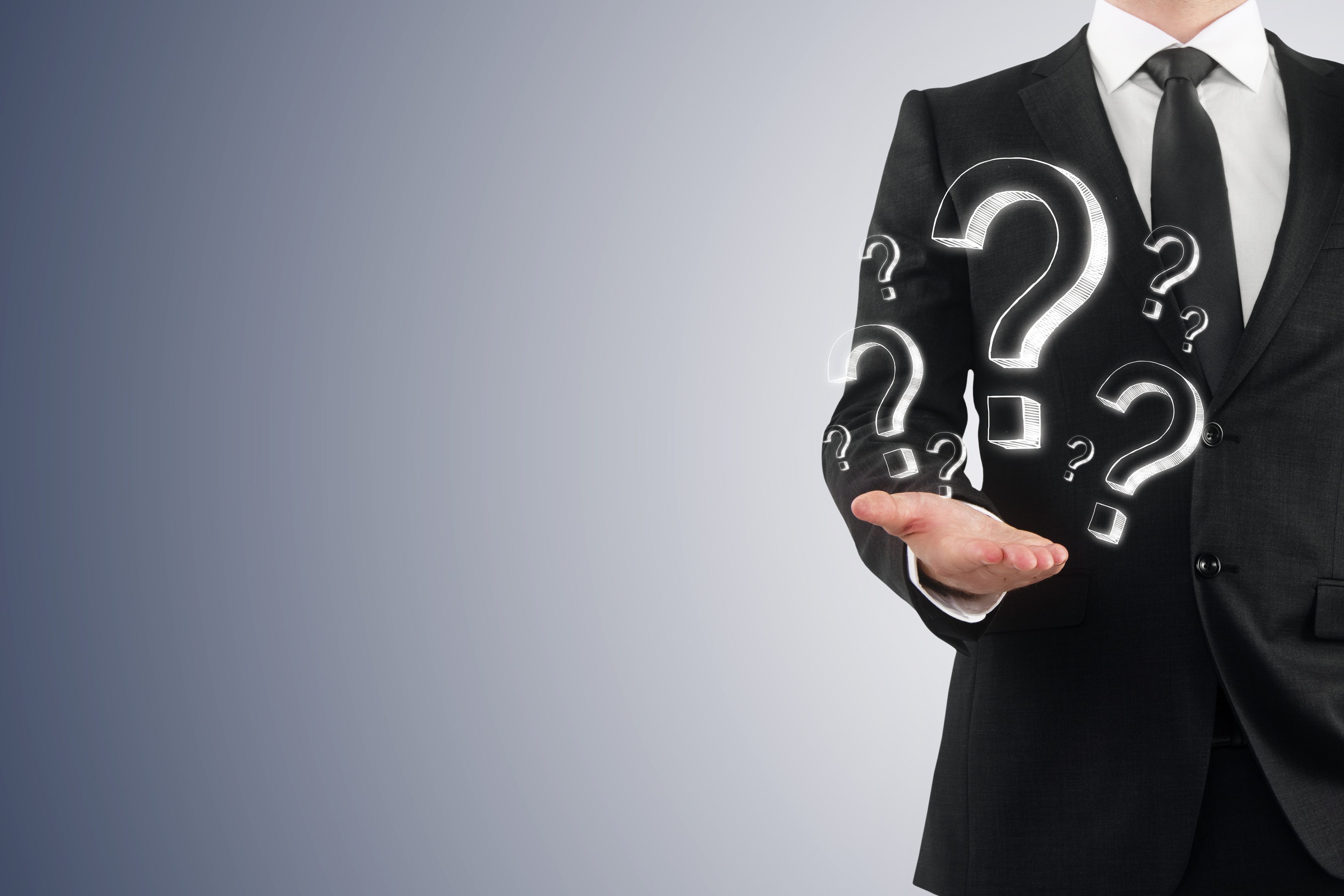 Male public adjuster in Long Beach in gray suit and shirt with red questions