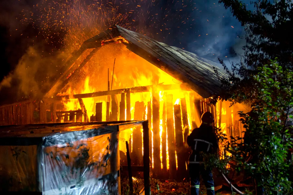 house engulfed in flames destroyed