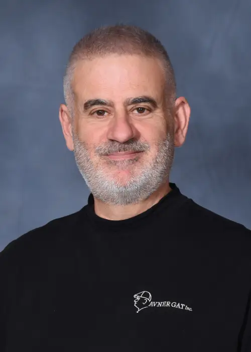 Avner Gat wearing his black company shirt